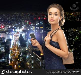 party, celebration, holiday and banking concept - beautiful woman in evening dress with small bag and vip card