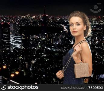 party, celebration, holiday and people concept - beautiful woman in evening dress with small bag