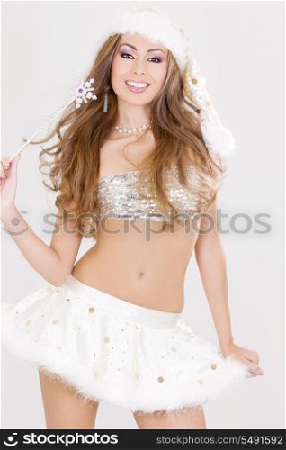 party dancer girl with magic wand in santa helper costume