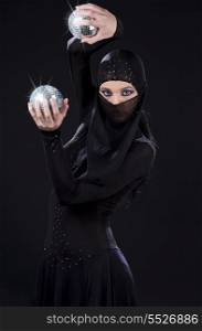 party dancer in ninja dress with disco balls