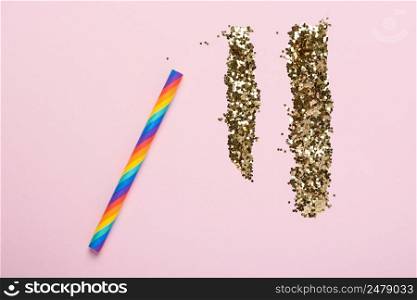 Party happiness addiction concept rainbow colorful straw and glitter on pastel background flatlay top view