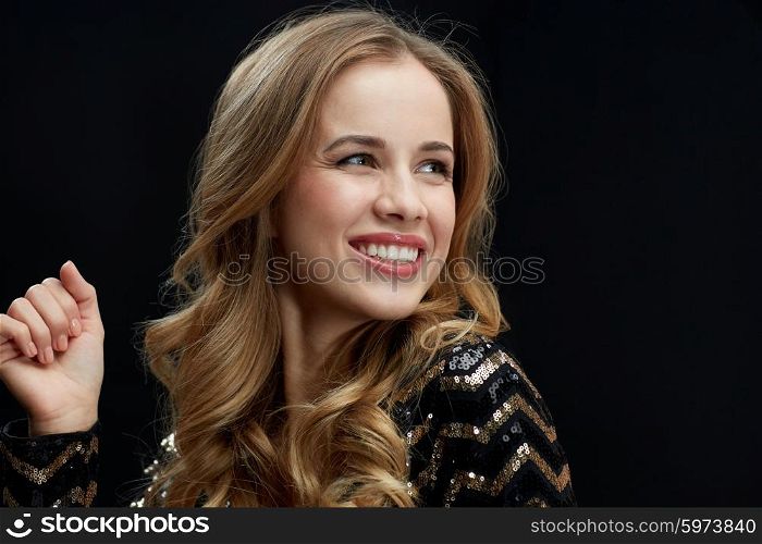 party, holidays, nightlife and people concept - face og happy young woman dancing at night club disco over black background