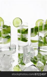Party mojito cocktails with lime and mint isolated on white background