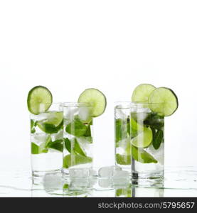 Party mojito cocktails with lime and mint isolated on white background. Mojito cocktails