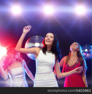 party, new year, celebration, friends, bachelorette party, birthday concept - three beautiful woman in evening dresses dancing in the club