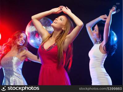 party, &quot;new year&quot;, celebration, friends, bachelorette party, birthday concept - three beautiful women in evening dresses dancing in the club