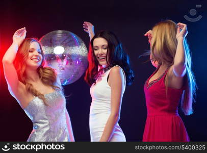 party, &quot;new year&quot;, celebration, friends, bachelorette party, birthday concept - three beautiful woman in evening dresses dancing in the club