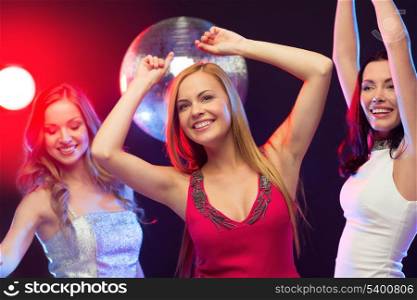 party, &quot;new year&quot;, celebration, friends, bachelorette party, birthday concept - three beautiful women in evening dresses dancing in the club