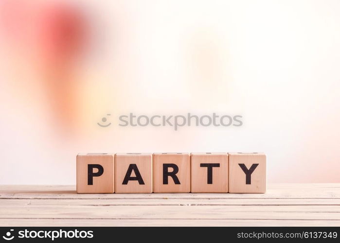 Party sign made of wood on an indoor table