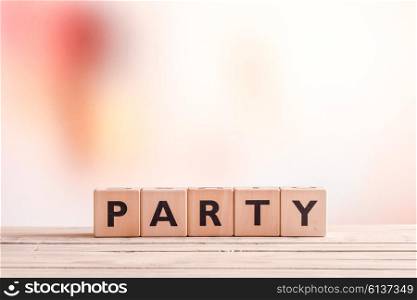 Party sign made of wood on an indoor table