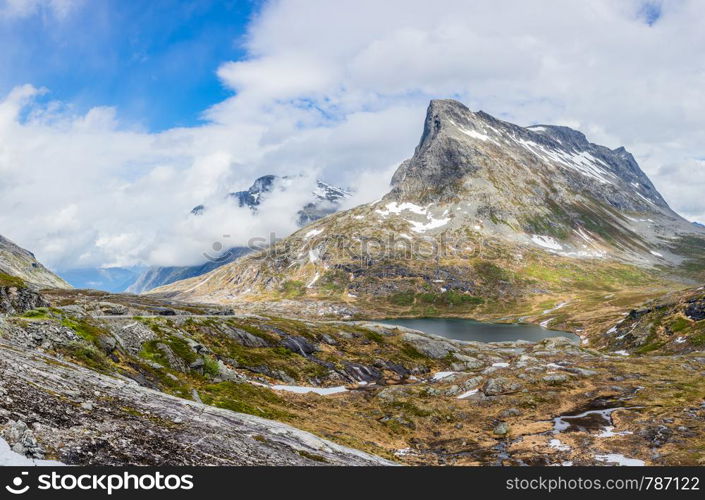 Passage in the mountains with snowy peaks around Alnesvatnet lake panorama, path of trolles, Trollstigen, Rauma Municipality, More og Romsdal, county, Norway