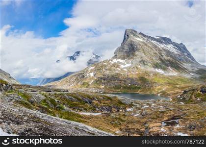 Passage in the mountains with snowy peaks around Alnesvatnet lake panorama, path of trolles, Trollstigen, Rauma Municipality, More og Romsdal, county, Norway