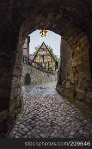 Passage in the wall of an ancient monastery on the road to the church of St. Servatius. Quedlinburg. Germany
