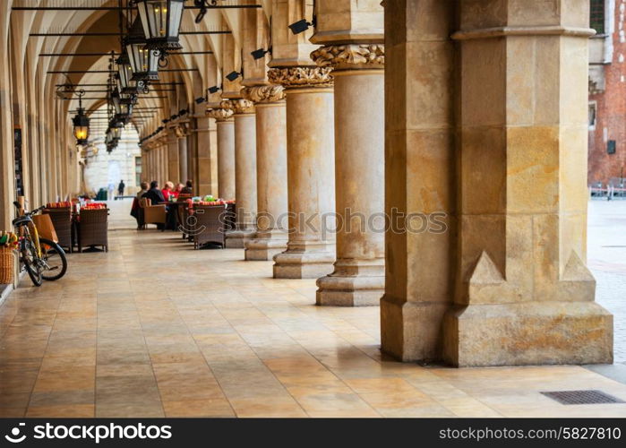 Passage of the gothic hall with columns. Main market square of Krakow city, Poland