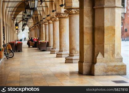 Passage of the gothic hall with columns. Main market square of Krakow city, Poland