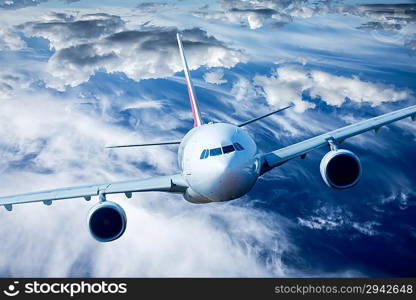 Passenger Airliner flying in the clouds