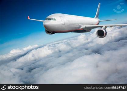 Passenger Airliner flying in the clouds
