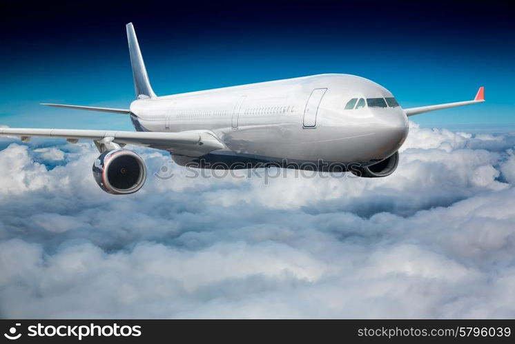 Passenger Airliner flying in the clouds