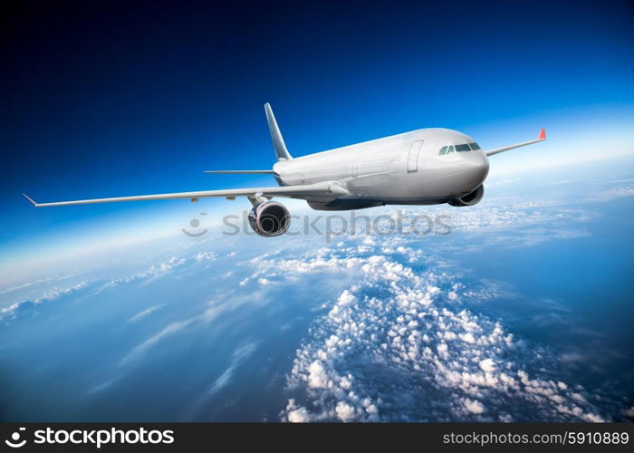 Passenger Airliner flying in the clouds