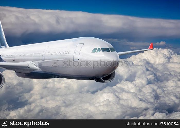 Passenger Airliner flying in the clouds