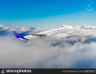 Passenger airplane flying above dramatic clouds