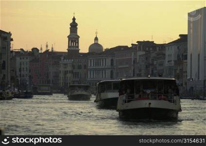 Passenger boats moving in a canal in Venice, Italy