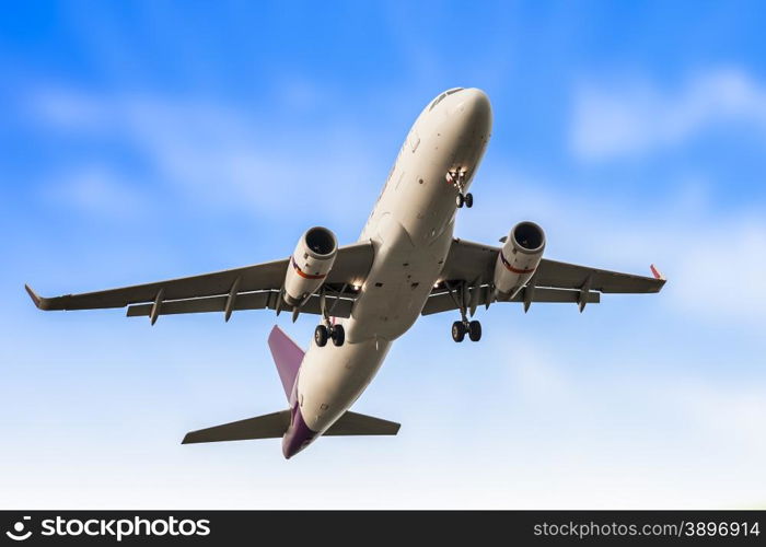 Passenger business airplane take off and flying in blue sky, use for air transport, journey and travel concept
