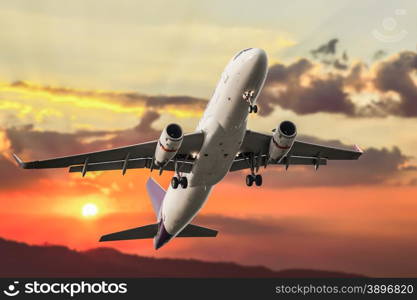 Passenger business airplane take off and flying on sky sunset, use for air transport, journey and travel concept