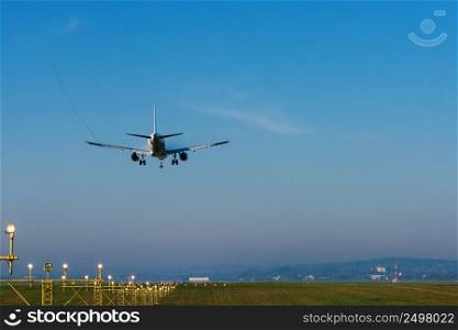 Passenger plane landing on airport runway