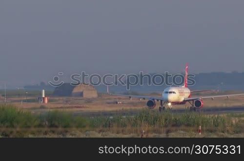 Passenger plane of airberlin airlines moving on runway after landing