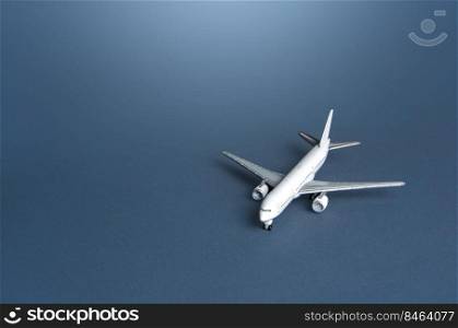 Passenger plane on a blue gray background. Passenger transportation. Business and tourism. Airline operators, air carriers. World communication and commercial flights. Travel.