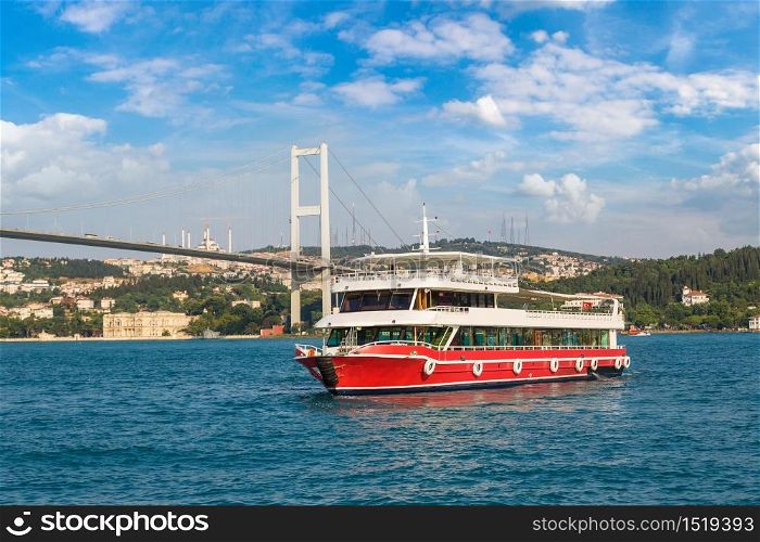 Passenger ship and Bosphorus Bridge in the Gulf of the Golden Horn in Istanbul, Turkey in a beautiful summer day