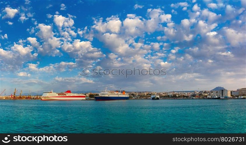 Passenger ships in the sea port, loading, unloading cranes in cargo port of Heraklion, Crete, Greece. Panorama