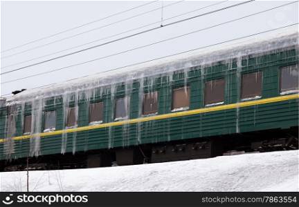 Passenger train covered with ice in snow