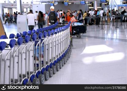 Passengers lining up at the check-in counter at the modern international airport