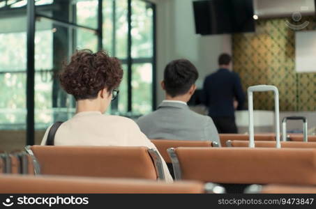 Passengers waiting to board the plane at the gate area