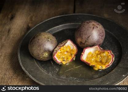 Passion fruit in moody natural light setting with vintage style