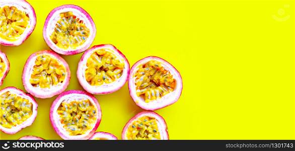 Passion fruit on yellow background. Copy space