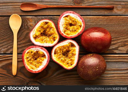 Passion fruits on dark wooden table