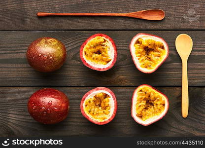 Passion fruits on dark wooden table