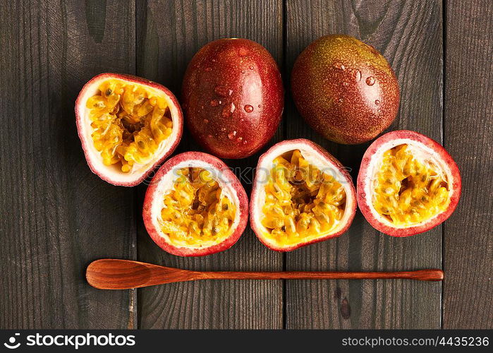 Passion fruits on dark wooden table