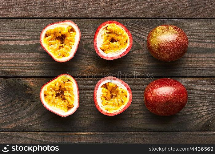 Passion fruits on dark wooden table