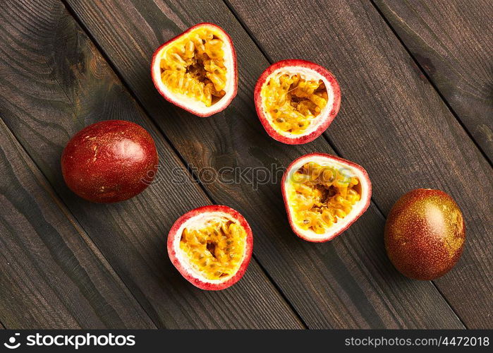 Passion fruits on dark wooden table