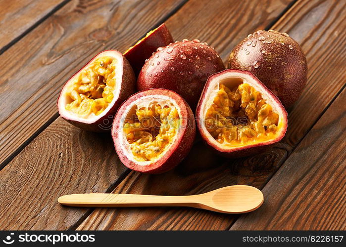 Passion fruits on dark wooden table