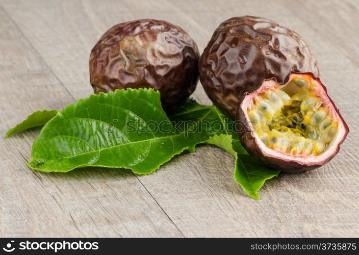 Passion fruits on wooden background