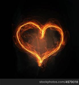 Passionate love heart. Glowing love heart symbol on dark background