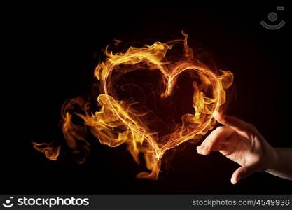 Passionate love heart. Hand touch glowing love hearts symbol on dark background