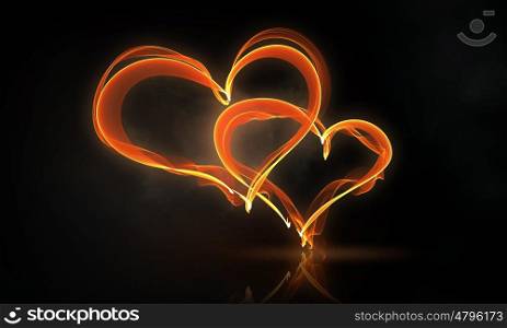 Passionate love hearts. Glowing love hearts symbols on dark background