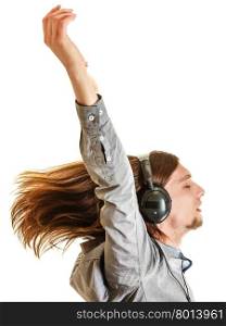 Passionate music lover. Man with headphones.. Passionate music lover with long hair flying and raised hands arms. Young man listening through headphones relaxing enjyoing. People relax leisure passion concept. Isolated on white background.