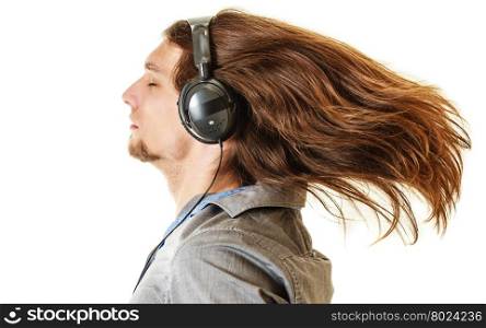 Passionate music lover. Man with headphones.. Passionate music lover with long hair flying. Young man listening through headphones relaxing enjyoing. People relax leisure passion concept. Isolated on white background.